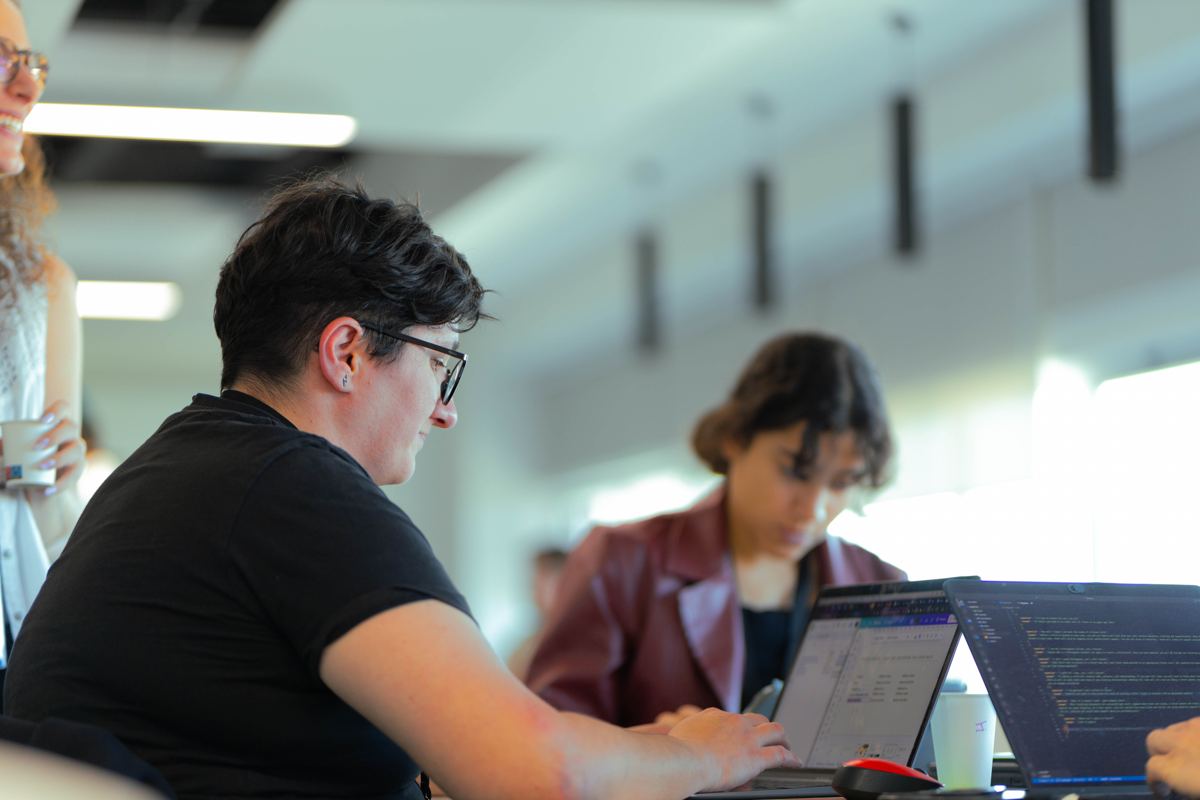 Participants coding at their laptops