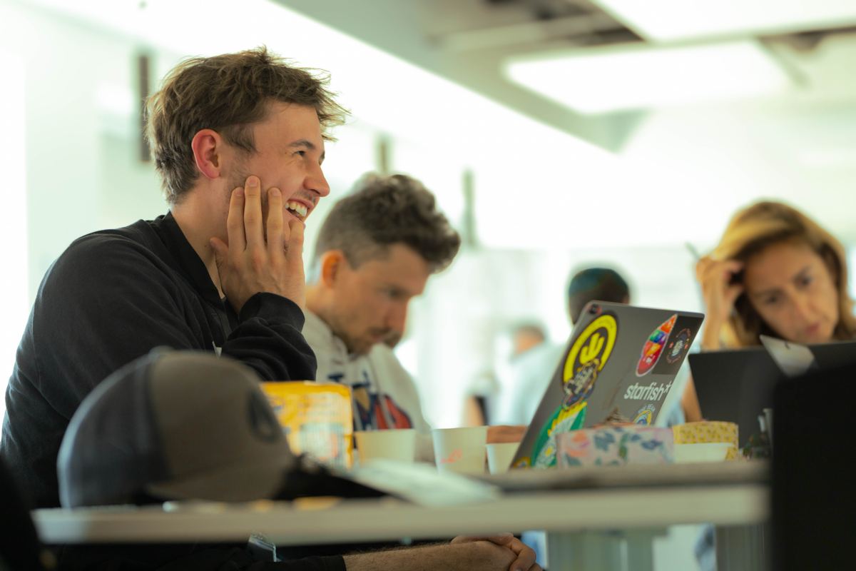 A participant laughing at his laptop